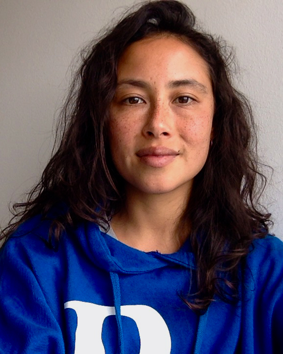 Lilian Steiner Lilian wearing a blue sweatshirt with long black hair to her shoulders image courtesy of the artist