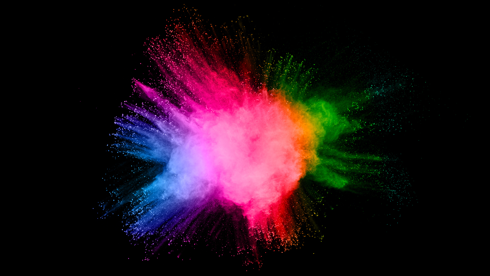 Image is a burst of rainbow chalk on a deep black background
