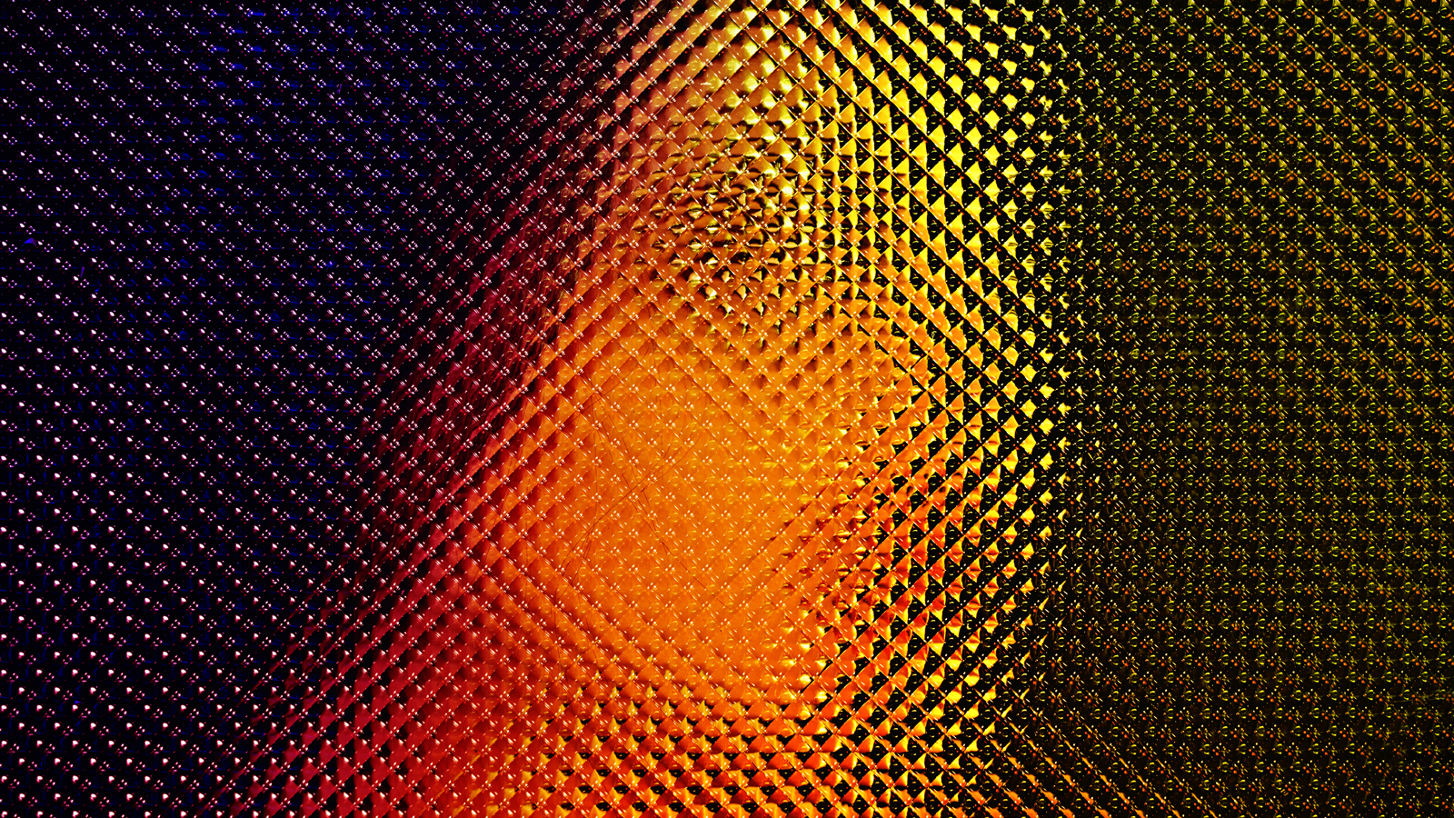 Image is a grainy pixelated face in orange and red with dark background